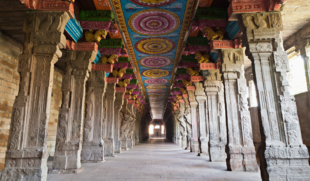 Stunning colorful stone-carved pillars of the Meenakshi Amman Temple in Madurai, Tamil Nadu including in South India Tour With Goa.