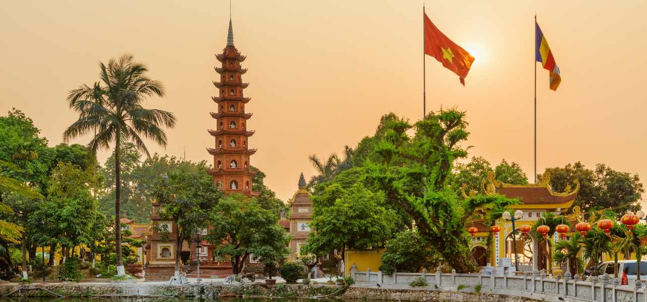A beautiful sunset view of the Tran Quoc Pagoda in Hanoi, a highlight included in our premium Vietnam tour package and vietnam tour packages from India.