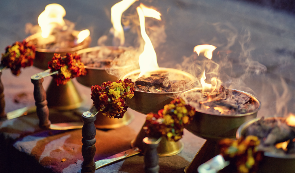Close-up image of traditional prayer lamps used during evening aarti, a spiritual highlight of our 9-day Ram Mandir tour.