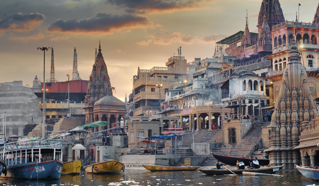 Devotees enjoying a peaceful boat ride along the Ganga in Varanasi