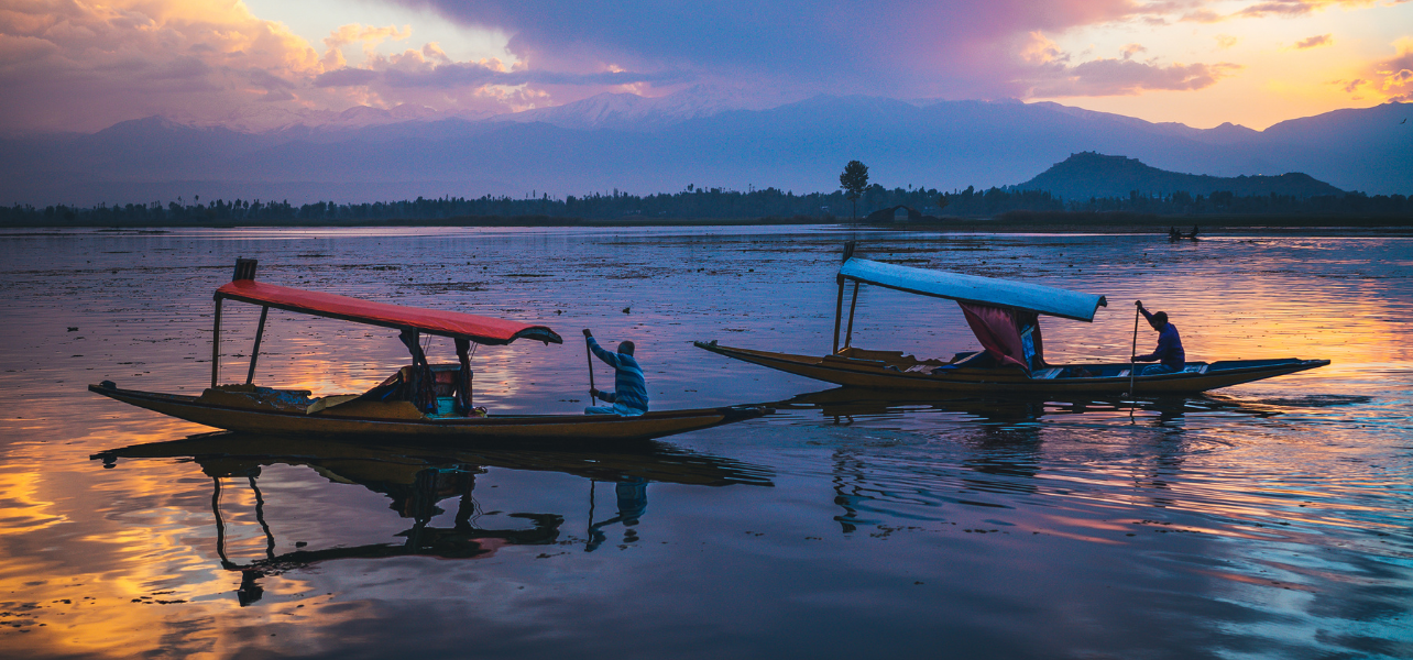 Kashmir Tour Package shikara sunset lake scenic view peaceful travel experience