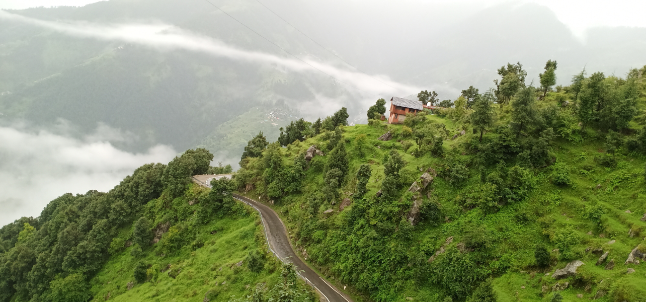 Chamba Weekend Tour Package scenic green hills and winding mountain road
