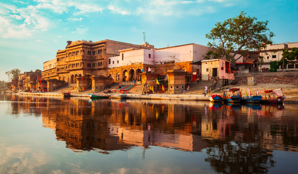 Beautiful reflection of Kashi Ghat on the Yamuna River, a peaceful part of our Vrindavan tour package and sightseeing in Vrindavan.