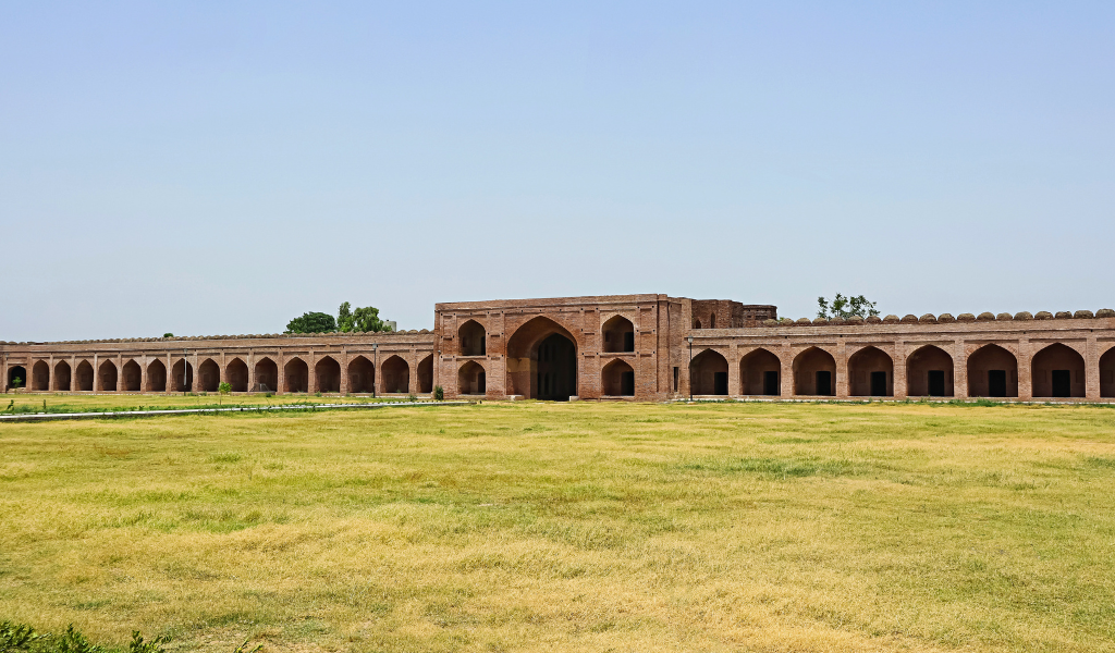 Ancient fort entrance gate with red brick architecture near Ludhiana Ludhiana Tour Package cultural heritage Punjab India