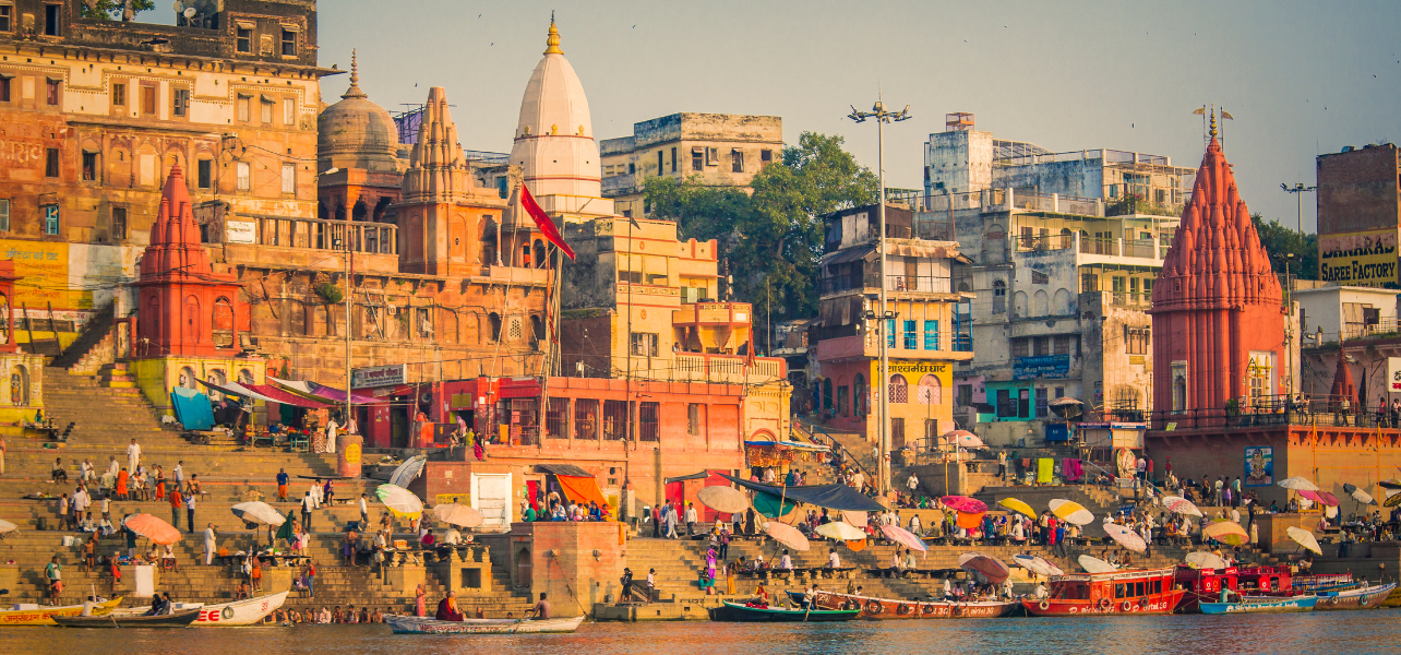 Beautiful view of the ancient Kashi Vishwanath temple and colorful ghats included in our professionally managed luxury Varanasi Ayodhya tour package.