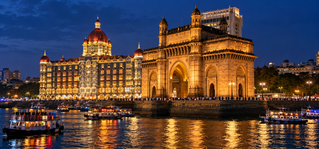 Mumbai Tour Package featuring the illuminated Gateway of India and Taj Mahal Palace at night