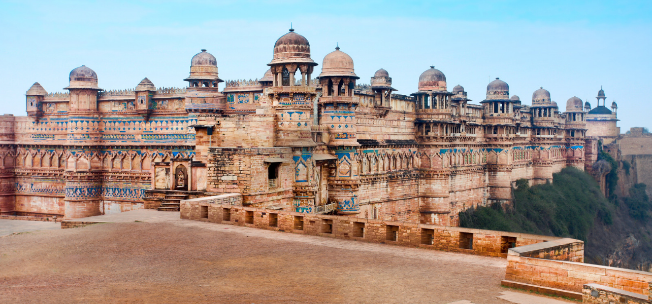 Front view of the historic Gwalior Fort and Man Singh Palace featuring ancient blue tile work image captured during Gawlior Tour Package.