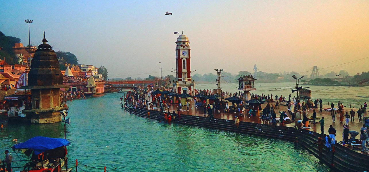Har Ki Pauri ghat and clock tower along the Ganges river on a Haridwar tour package