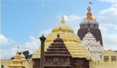 Shri Jagannath Temple Puri outer view with sacred flag fluttering on main temple spire during Puri trip package