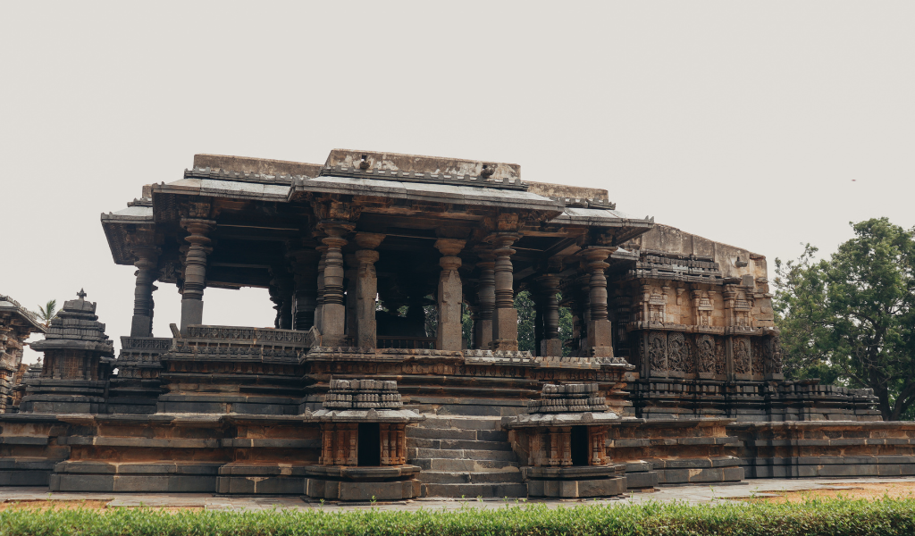 Carved stone ancient temple structure inside Bandhavgarh National Park image Capture during Bandhavgarh tour package