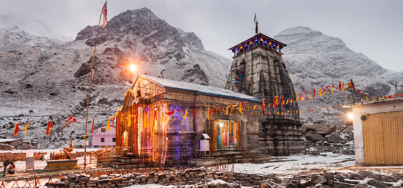 Chardham Yatra Package From Mumbai Kedarnath Temple in snow covered Himalayas Uttarakhand