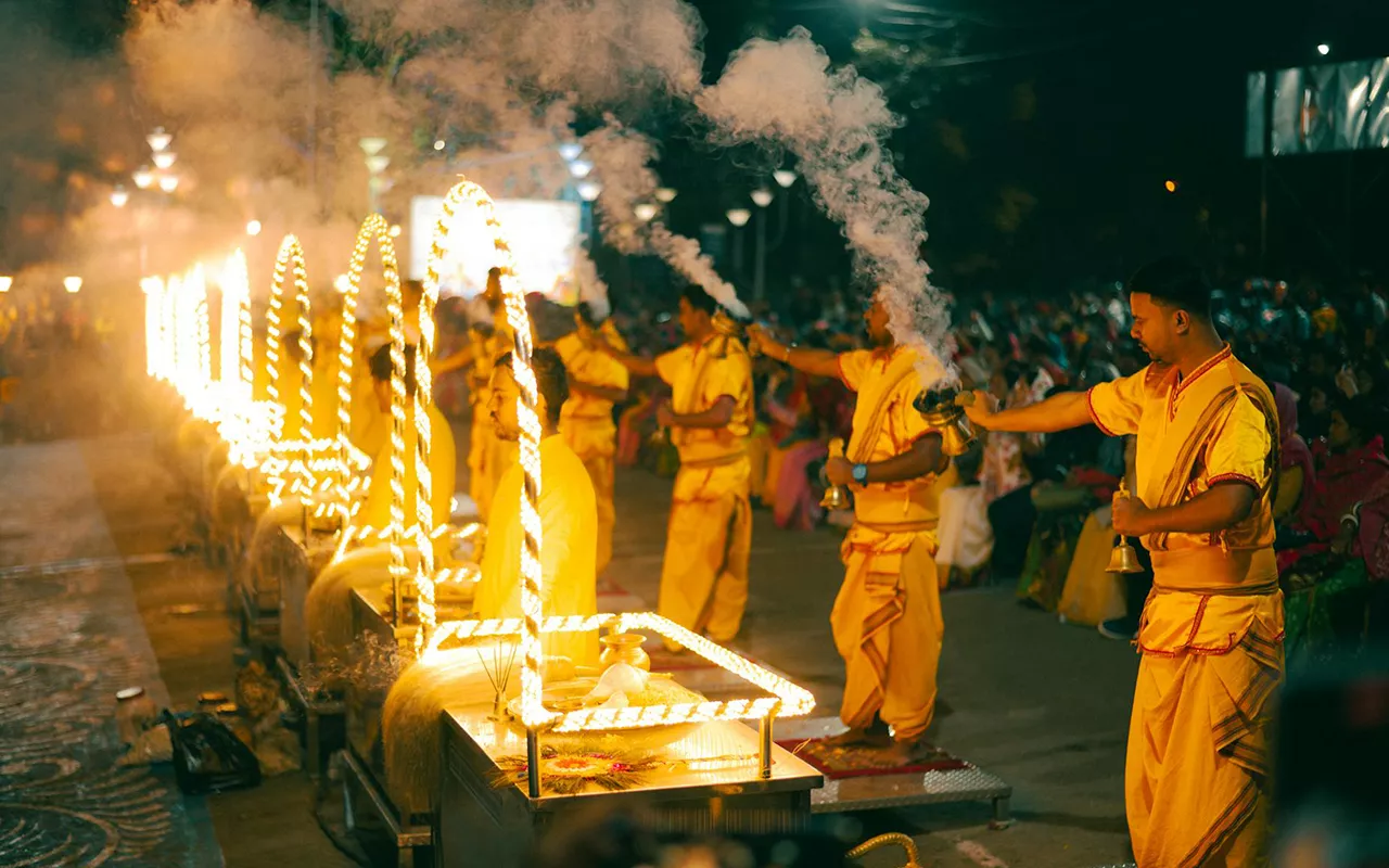Priests performing the grand Ganga Aarti at Dashashwamedh Ghat, an essential experience in every Varanasi tour package, image captured during varanasi holiday tour package
