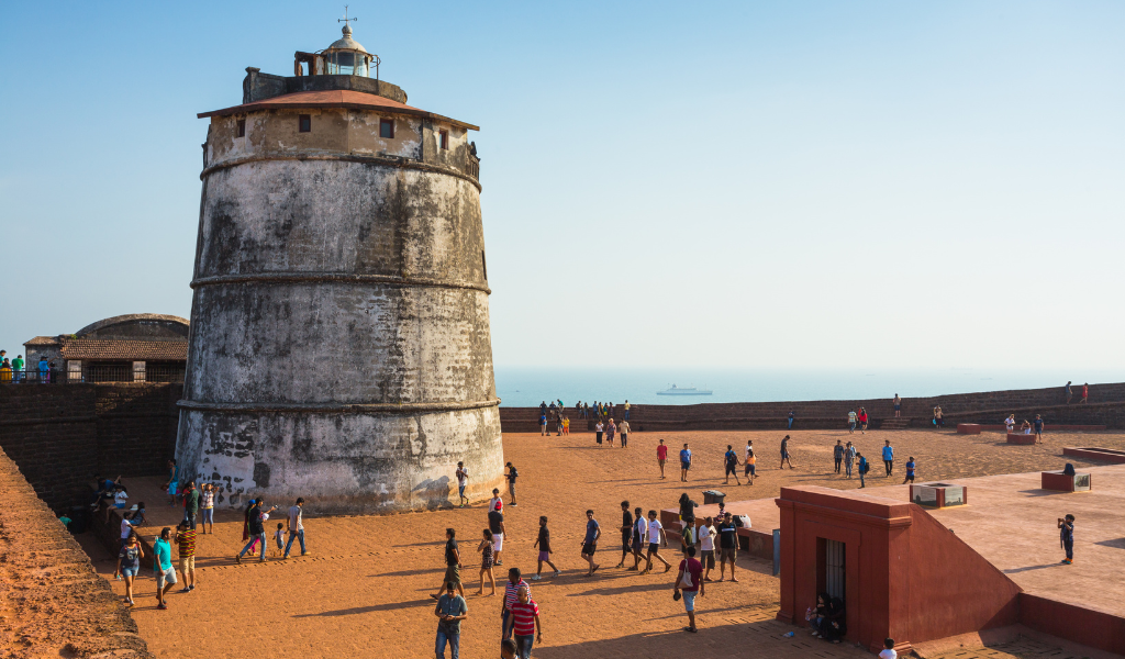A view of the historic Fort Aguada lighthouse, a top inclusion in our Goa Tour Package From Delhi for travelers seeking beach holidays in goa with a touch of history