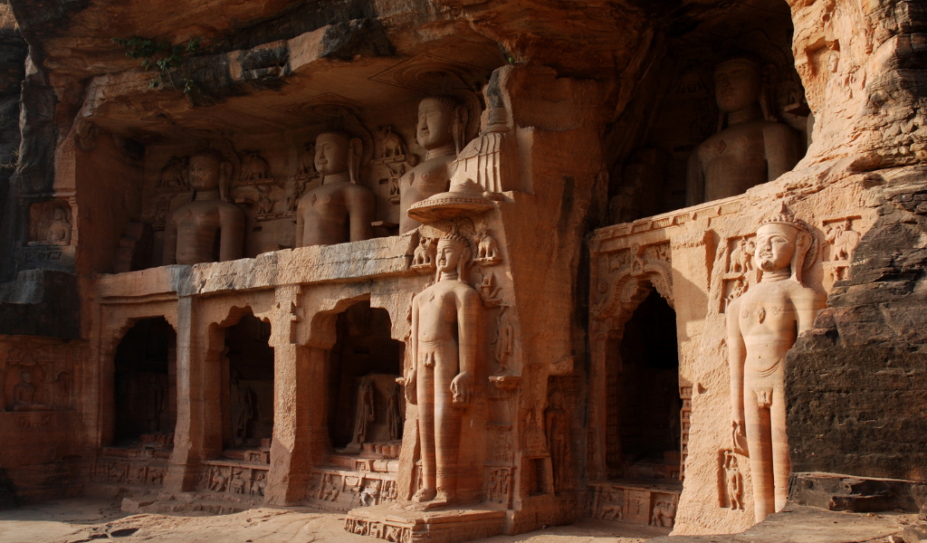 Ancient rock-cut Jain Tirthankara statues along the cliff walls of Gopachal Parvat Gwalior During Gawlior Tour Package.
