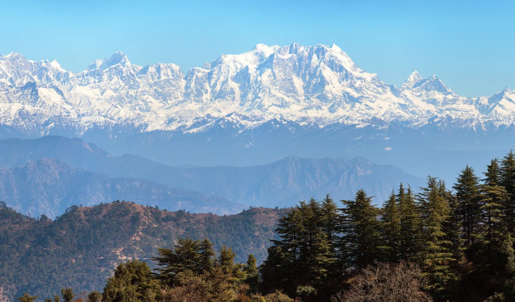 Scenic snow-capped mountain peaks view featured in our kausani mukteshwar tour package