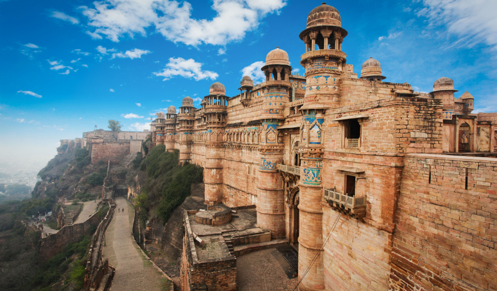 Beautiful view of Gwalior Fort ramparts and winding road on Gopachal hill During Gawlior Tour Package.