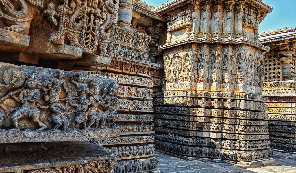 Detailed stone reliefs and ancient temple wall carvings included in Orissa holiday tour package