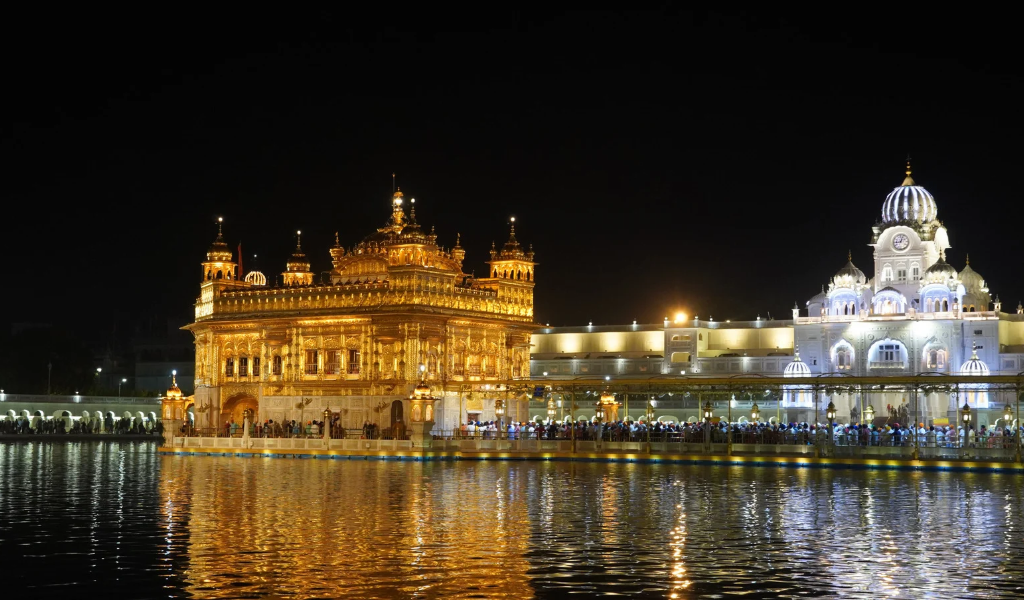 Illuminated Golden Temple Sri Harmandir Sahib at night for dharamshala dalhousie tour with amritsar