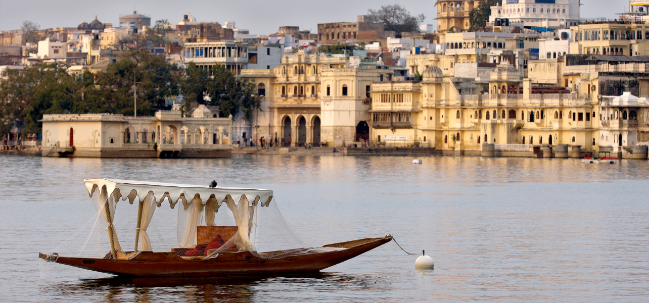 Udaipur tour package boat ride on Lake Pichola with city view Rajasthan
