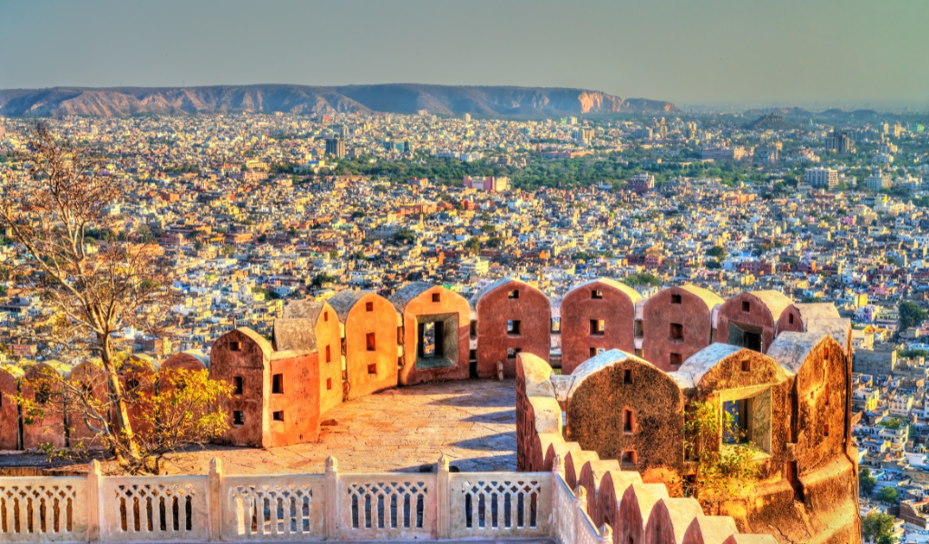 Beautiful view of Jaipur city buildings from yellow stone fort wall captured during Jaipur Udaipur Jaisalmer Tour Package