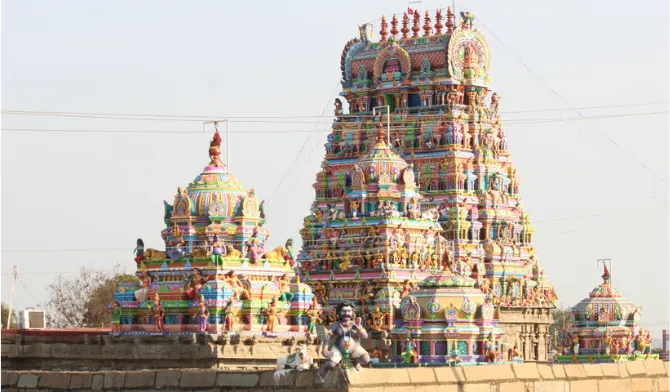 Intricately painted colorful temple tower and shrine included in Jagannath Puri tour package sightseeing